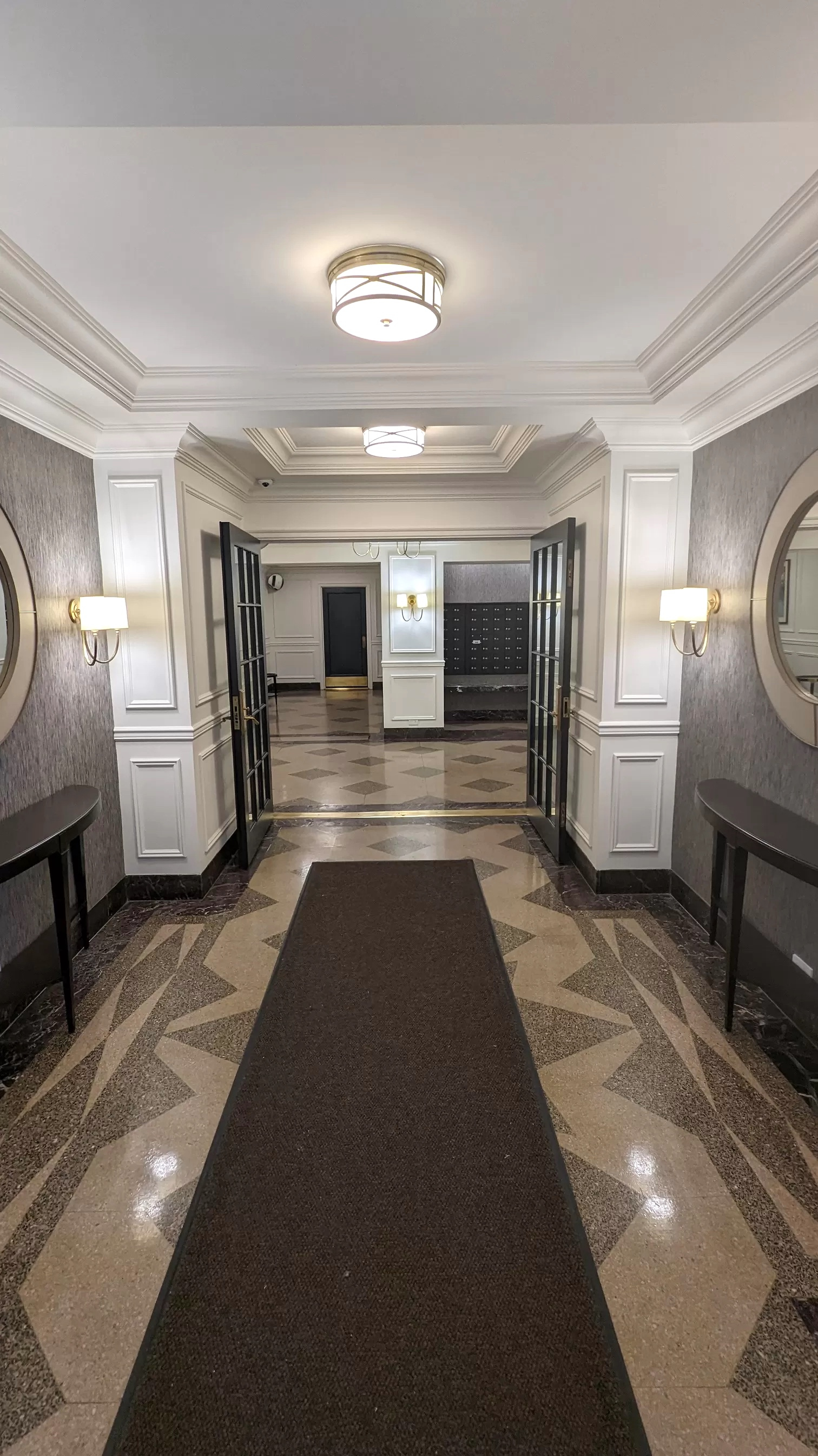 Modern office foyer with flooring, lamp, and decor